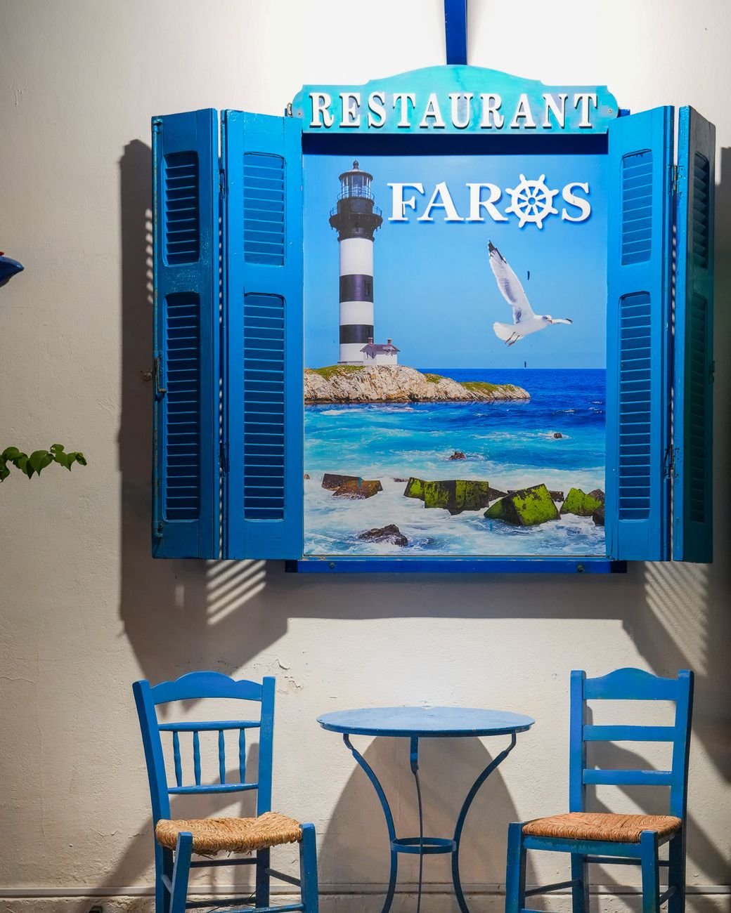 The painted sign by the door