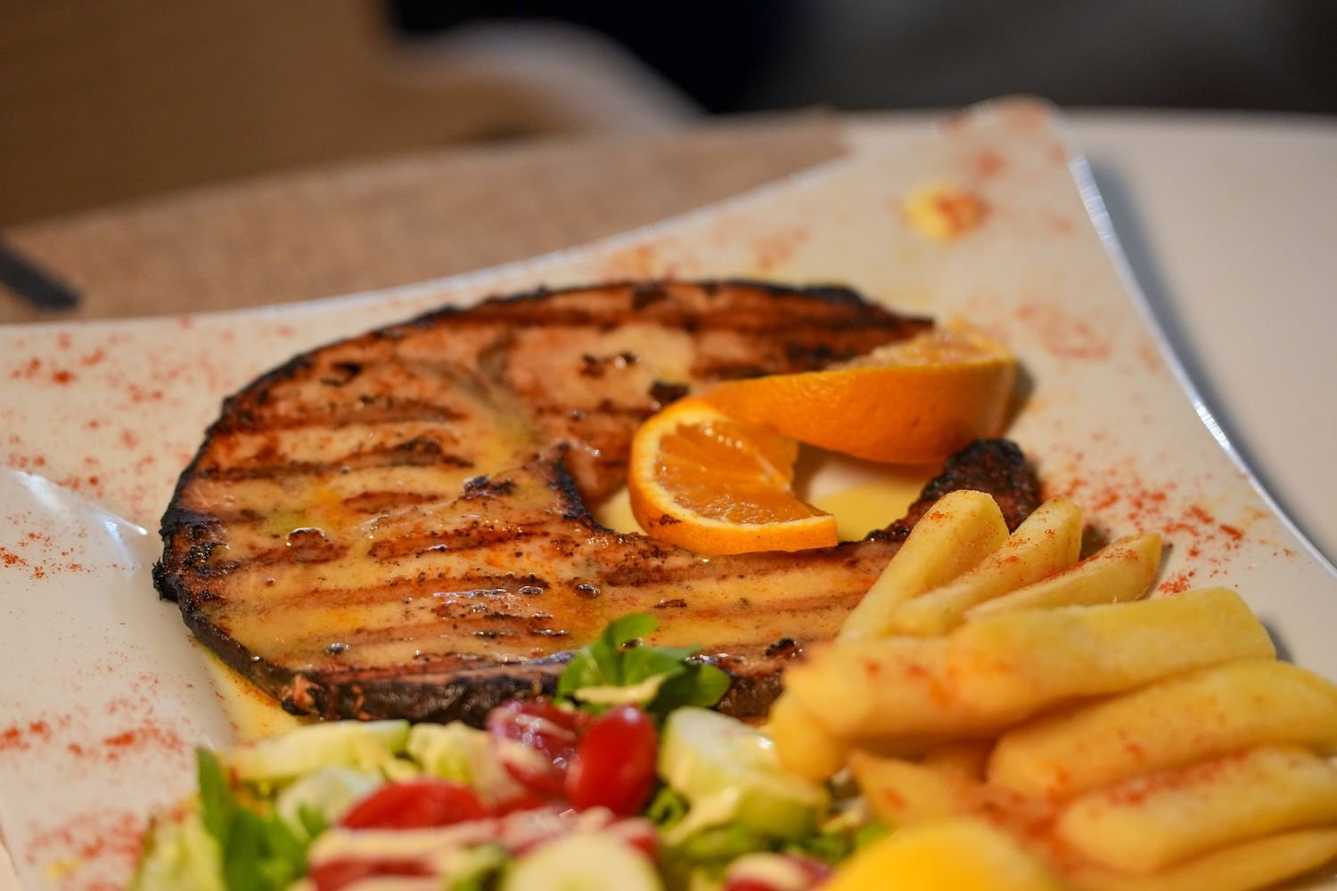 Grilled swordfish with chips and salad