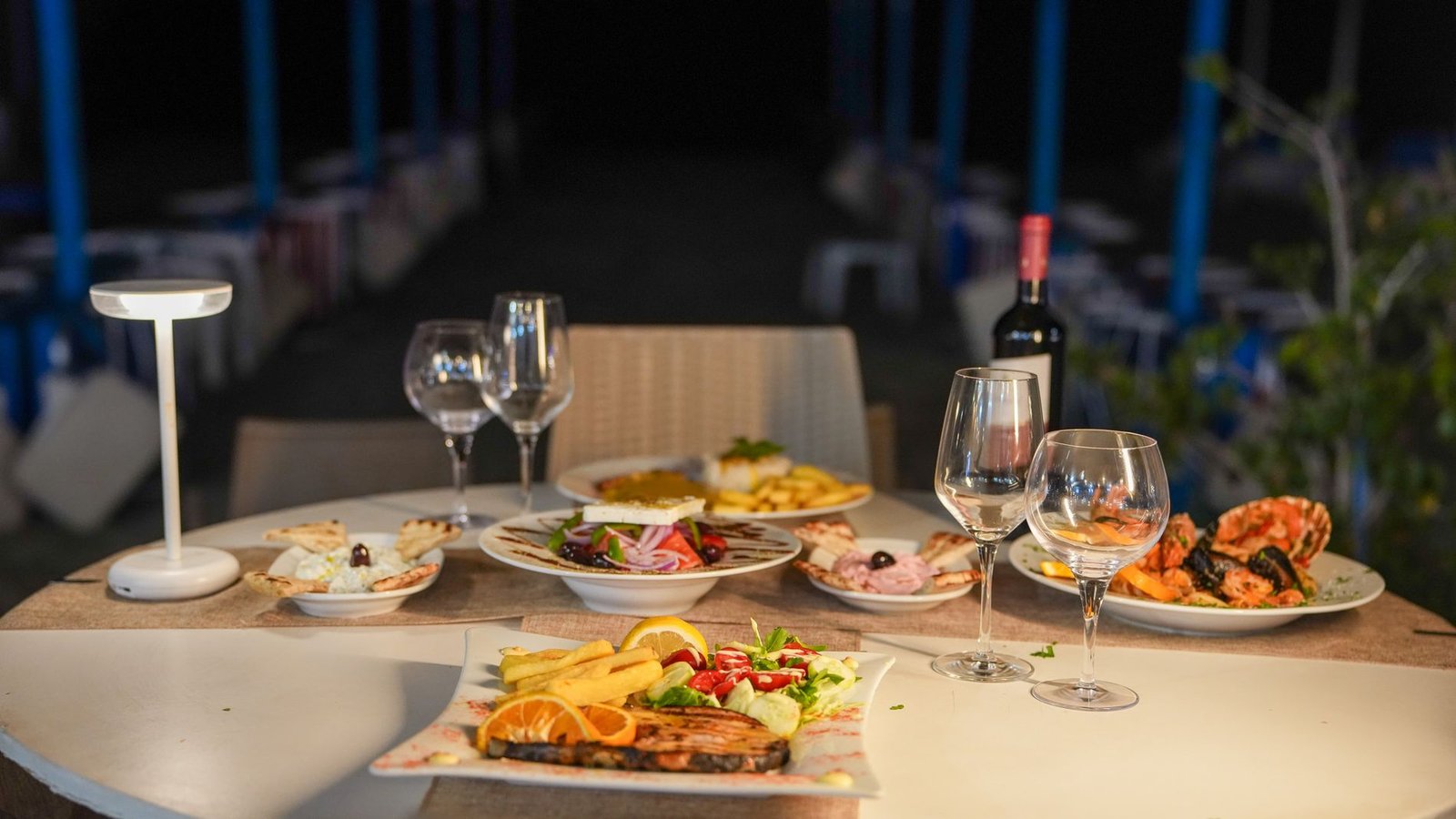 A table laid for dinner by the sea